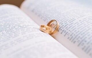 Weddings rings resting on a book