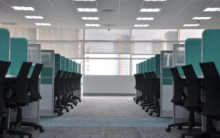 An image of an empty modern office with chairs and desks