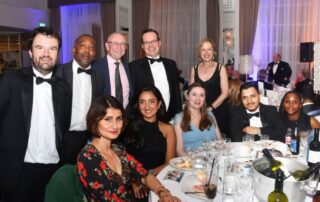 The barrett and co team sitting around a dining table as the annual award ceremony held at the Castle Hotel, Windsor