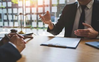 two men in suits talking in a business meeting