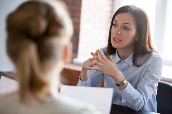 A solicitor gives employment legal advice to a client during a consultation