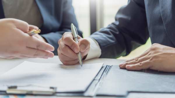 An employment solicitor consults with a client