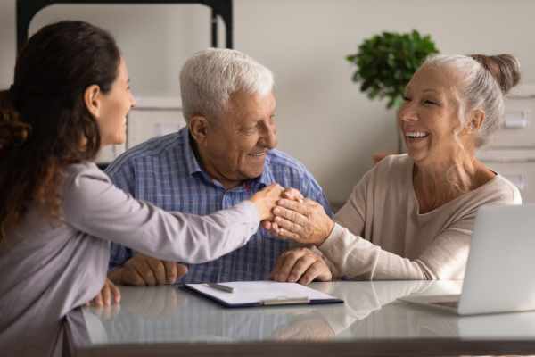 An elderly couple consult a solicitor on the probate process